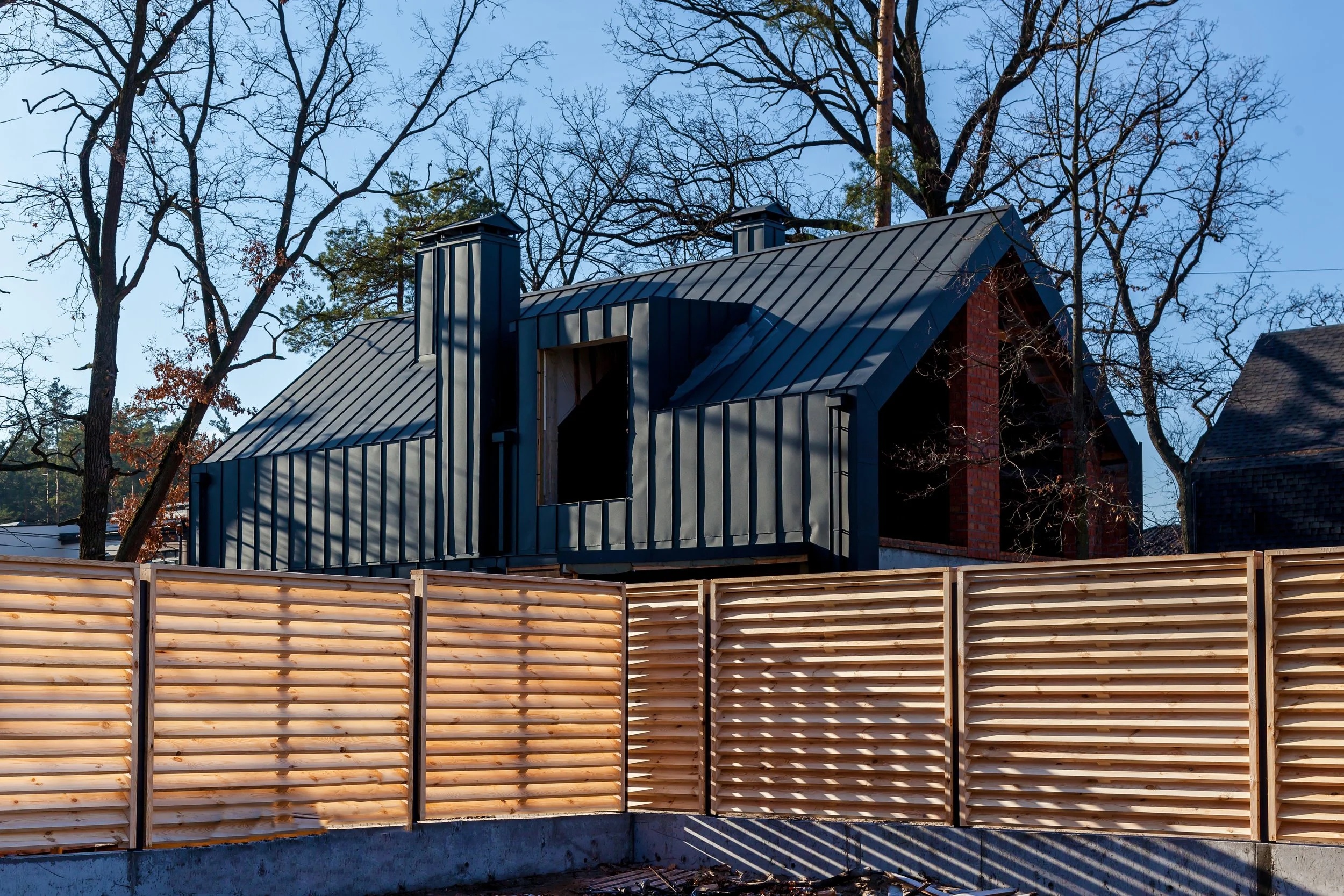 Wood privacy fence along a property line